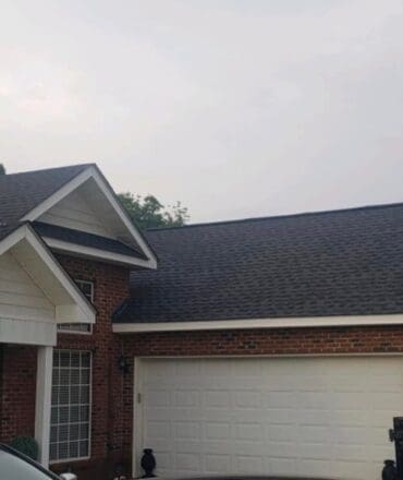 Modern home showcasing a pristine metal roof by Eagleview Roofing Systems.