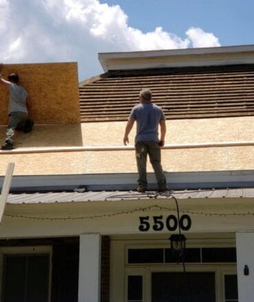Emergency roof repair services in action at a residential house